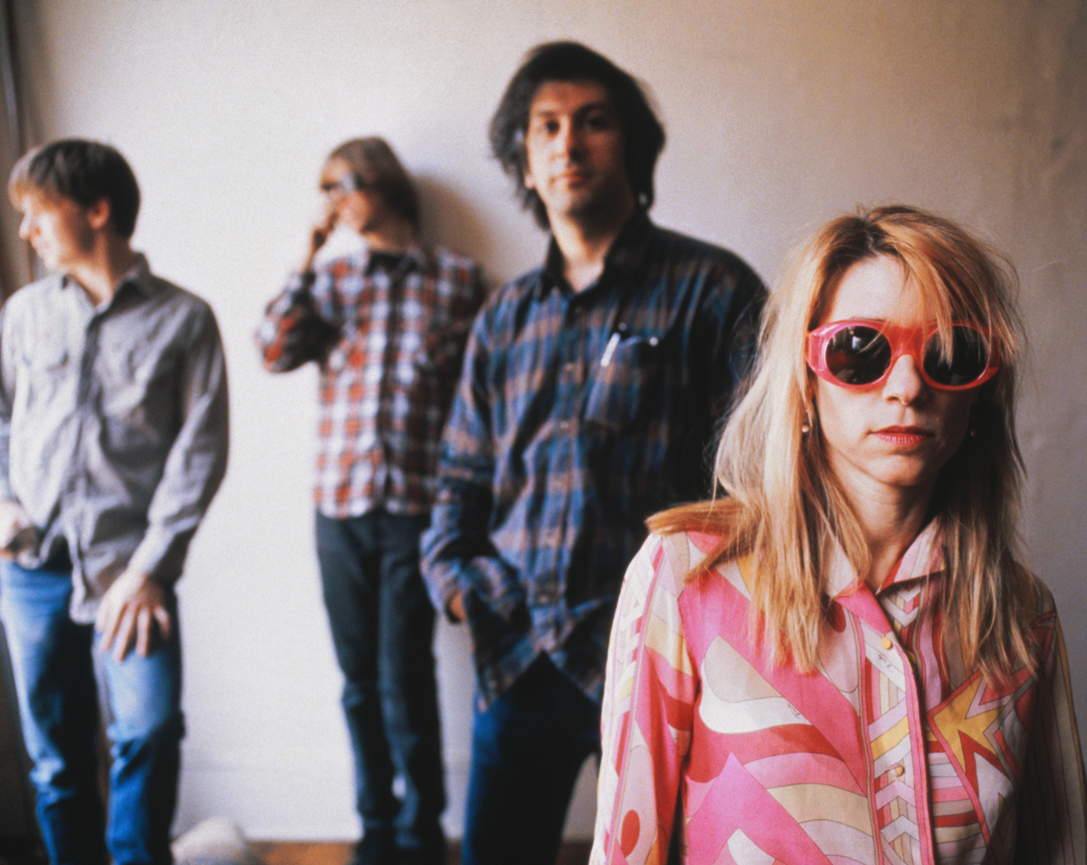 Don't Give Me Your Soul: The Oral History of Sonic Youth's <i></noscript>
<p><strong>THE STUDIO</strong></p>
<p><strong>Moore:</strong> God only knows what <em>Goo</em> would have sounded like if we did it in Wharton Tiers’ basement. That’s where we did <em>Confusion Is Sex</em> and <em>Kill Yr Idols</em>; maybe <em>Goo</em> would have come out the same way. All I know is that we did some demos for <em>Goo</em> that were more like eight-track demos, and there’s aspects of those that I find more interesting than what happens coming out of a 24-track board. I really liked the energy on those demos, because it sounded like the 24-track kind of spread things out a bit and it’s slightly more dissipating. It’s a learning process, the technology of it all. We were never a studio band in the sense of Pink Floyd or Steely Dan, where they were really utilizing every inch of it. We came to do that when we had our own studio, Echo Canyon, later on in the ’90s.</p>
<p><strong>Kim Gordon:</strong> We were excited. That was our first getting-out-of-the-basement-type recording situation. I mean, we did record at Sear Sound. But Sear Sound at the time was pretty lo-fi. But in a great way.</p>
<p><strong>Ranaldo:</strong> It was our first major-label record; we were second-guessing ourselves, like, is this mix good enough? This is pretty easy to do in the studio. And I’ve seen this happen to other bands from our scene that graduated to a major and got freaked out a little bit about making their first record. We weren’t sure the mixes with Nick Sansano were what we wanted, so we stopped working with him after a couple of sessions. We were desperate to try and finish this record, so the label brought in Ron St. Germain and we kind of referred to him as a console cowboy. He was a pilot at one point, I think, so he was really into all the tech stuff. And he did a really good job mixing it, though it was probably not mixed exactly the way we would have on our own.</p>
<p><strong>Moore:</strong> I remember the engineer telling us that we would be using the B-room, because Public Enemy were going to be doing their new sessions in the other room. When we found that out, we were like, ‘Where do we sign?’ This was the perfect situation because I was so huge into <em>It Takes a Nation of Millions to Hold Us Back</em>. When we started recording there, I had everybody involved with that record in the studio at the time, so I have the CD that has like 40 signatures on it with the entire crew of PE somewhere. Ice Cube had come by for one day and was hanging out right when N.W.A was hitting and he had to be in New York. I remember Chuck D calling him ‘Cubism’ and things like that.</p>
<p><strong>Shelley:</strong> We were recording at Greene Street Studios at the same time as Public Enemy, and Kim invited Chuck to say something on the middle eight of “Kool Thing.” But we would also spend time with Eric ‘Vietnam’ Sadler from the Bomb Squad, and he was really interested in what we were doing. Sometimes Flavor Flav would come by and sit with us for a bit and talk. But Eric seemed to be the most curious about what this band was doing with all these noisy guitars and everything.</p>
<p><strong>Moore:</strong> Vietnam would always pop in and see what we were up to. He was the one who asked Chuck about being on “Kool Thing,” and within minutes, Chuck just rambled in. We asked him if he wanted to hear the song first, but he was like, ‘Nah, that’s alright, I’ll just put on the headphones and just run it.’ It was super, man, he did it in just one take. He listened, heard Kim’s recitation in the middle and he just flowed with it freestyle and then boom, that was it. <strong><br />
</strong></p>
<p><strong>Gordon:</strong> Hip-hop was a really big part of downtown music in a way. It was a place where so many things would collide, whether it was like the tradition of jazz in New York City, and then hip-hop coming from uptown to downtown and then all the new classical music from like La Monte Young and Rhys Chatham. It was all kind of melding together. It felt like walking down a street in New York, just this constant bombardment of sounds.</p>
<img src=
