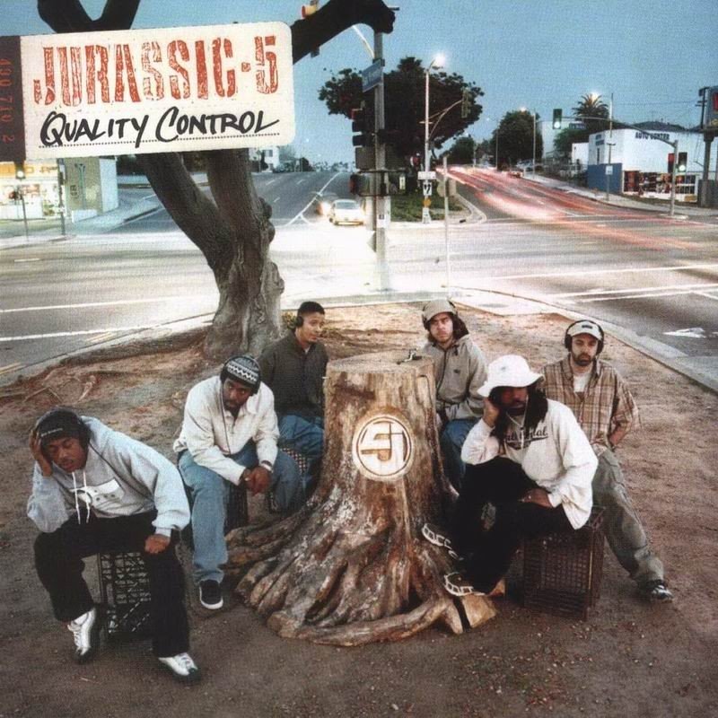 Great Expectations: An Oral History of Jurassic 5's <i>
<h2></h2>
<h2><strong>The Album Cover</strong></h2>
<p> </p>
<p><strong>Nu-Mark:</strong> There was a Jethro Tull record that I owned—[<em>Songs from the Wood</em>]—that had a closeup of a needle on a record stump. I was like, this would be incredible for us if we can get it right. I told B+ the concept.</p>
<p><strong>B+ (photographer):</strong> Dan [Dalton] said, “I have a friend who is a woodcarver. He’s short of work, and he’d love to get involved.” The dude finds out that we could get a tree in Golden Gate Park in San Francisco. We have to go out and choose the tree. So we went with this U-Haul and picked out this tree. It took him like two months or something, and he came back with the fucking tree.</p>
<p><strong>Marc 7:</strong> We were in San Francisco. I don’t know where Dan took us. We went somewhere that just had a bunch of tree stumps. We were looking around everywhere for the perfect stump… When we finally saw the finished product, we were blown away.</p>
<p><strong>B+:</strong> Then it turned into a whole other fucking debacle. This tree, even though it was hollow on the inside, still weighed like fucking 400 or 500 pounds. We were like, “Where are we going to shoot it?” The alternate cover was them looking over L.A. at night. We got the photos back from the lab and Nu didn’t like it. The actual cover is a product of the second attempt, which we did on San Vicente. One of them was living or working right nearby there. It was like, “There are trees already there. What if we try doing it here?” My suggestion was doing it right at the end of the day when the sun is gone and we could have a long exposure.</p>
<p><strong>Nu-Mark:</strong> When I saw the photos come back, I was like, “Fuck, he’s too far away.” If you look at the photo, the camera is very far away from the actual needle on the grooves of the tree stump. You can’t really see that. We did our best with our graphic artist Keith Tamashiro. There were other really great options. There were really close options, but it didn’t really speak to the needle on the grooves of the wood. The San Vicente thing was just a good spot to capture the movement of L.A. around us.</p>
<p><strong>B+:</strong> Nu-Mark was like, “You can’t see the needle going into the ring of the tree.” I was like, “Yeah, because I’m fucking standing fifteen feet back to get everybody in the photo. Of course, you can’t see the needle.” He was like, “But we have to be able to see the needle going into the tree.” It’s a complicated thing to be able to do a pretty large group photograph and pull a detail that ostensibly lives in a square inch of the photograph. It was crazy. Keith Tamashiro was the designer and was very much an integral part. In the end, he was the one that helped me to understand Nu-Mark.</p>
<p><strong>Cut Chemist:</strong> When I look at that picture, it’s L.A. This is an L.A. group. I think that’s what they were trying to get across. And then you have six people you’re trying to get in frame. So, of course, the trunk is going to be really small and you can’t see the tonearm that we spent a lot of time putting together. I think it was the only choice. There’s one on the inside of the tree up close. To me, I was like, “That’s the fucking picture.”</p>
<p><strong>B+:</strong> This was an era where no one looked happy on their record covers. Smiling was for R&B records. Hip-hop was ice grill. You had to look fucking mad or upset. They say smiling for photographs is actually a fairly contemporary thing. The last 70 years is when people decided they could actually smile. Miles Davis made it very clear by clowning on Dizzy and them saying they smiled too much at the bandstand. Hip-hop definitely adopted that mantle. Cats were meant to look deadly serious. I think everyone was pulling their serious face. Jurassic wasn’t trying to be hard or nothing, but you didn’t smile on your cover.</p>
<p><strong>Cut Chemist:</strong> Look at my face on that shit. I’m just over it. <em>[Laughs.]</em> I think that was the first location. The inside joke after the fact was, “Are they listening to the album they just finished? If so, they don’t look thrilled with the material that they’re selling us.”</p>
<p><strong>Marc 7:</strong> Look at our faces and what we’re doing. Look at all of our faces and then look at the title. What are we doing? That’s why we’re so intense. It’s quality control. We’re trying to see if this shit is ready.</p>
<p> </p>
<div class=